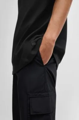 Camiseta oversize fit para todos los géneros en algodón con etiqueta con logo