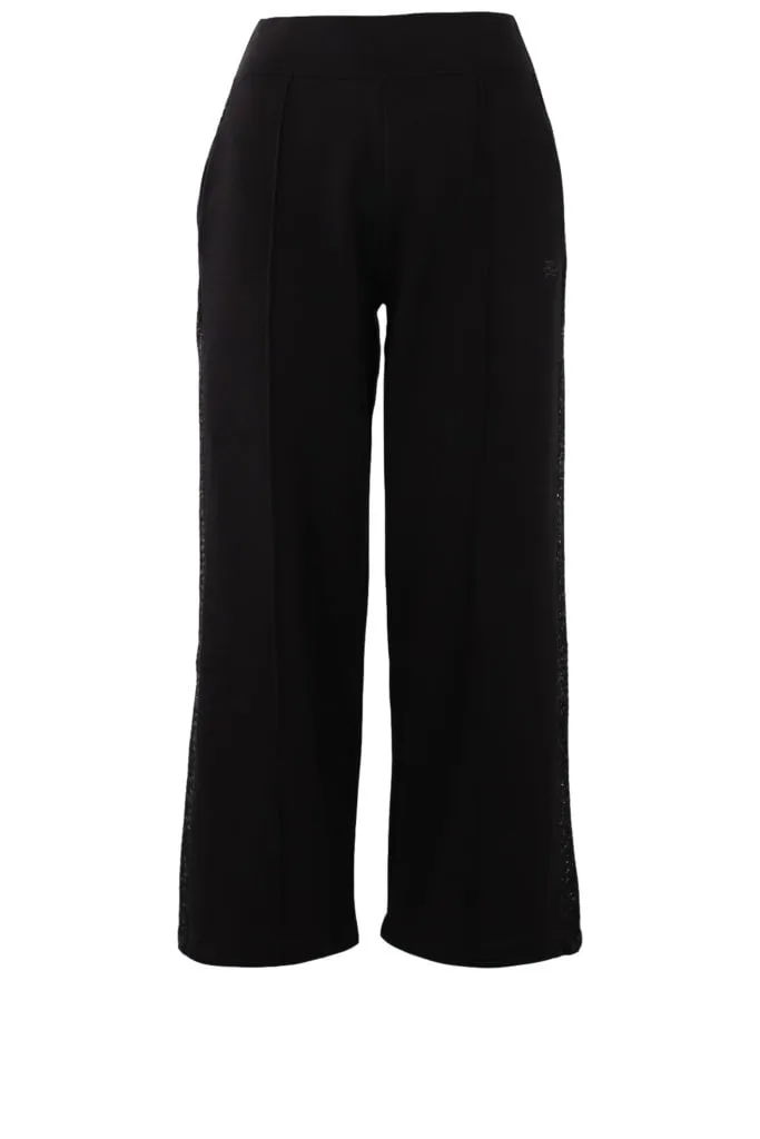 Pantalón negro con cinta de bouclé